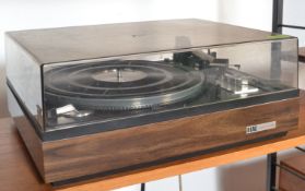 A vintage teak cased Elac Miracord turntable record deck, teak body with smoked perspex lid.