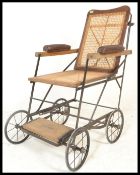 An early 20th Century invalid / promenade chair by Alwin, folding frame cane panelled seat and