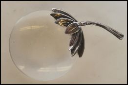 A stamped 925 silver magnifying glass of small proportions having a handle in the form of a
