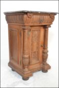 An early 20th Century oak pedestal hall cabinet / cupboard / pot stand. Topped with rouge marble