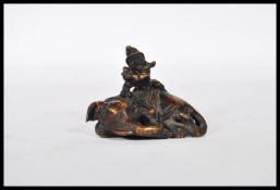A small bronze Indian figure of a elephant lead do