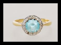 A 18ct gold dressing having a prong and white meta