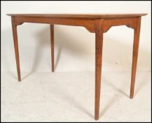 A good mid century oak dining table, possible Air Ministry origin. Raised on turned legs with a