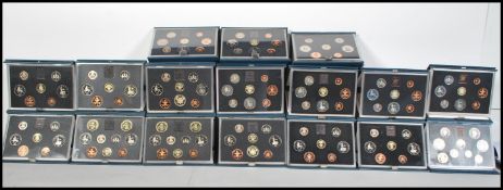 A collection of 17 cased sealed and boxed United Kingdom Proof Coin Collection from the Royal Mint