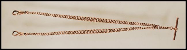 A 9ct gold albert chain / necklace of roundel form having graduated kerb link chain complete with