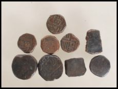 A group of believed Ottoman Empire Akce bronze coins / tokens, most of round form with enmbossed