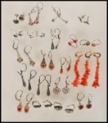 A large collection of stamped 835 silver drop earrings set with a variety of coloured stones, and