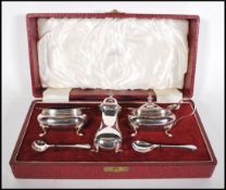 A vintage 20th Century Walker and Hall silver plated condiment cruet set complete in original box