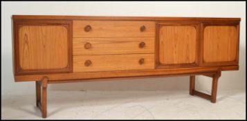 A retro mid 20th Century teak wood sideboard credenza, two cupboards to right of bank of three