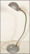 A vintage industrial mid 20th Century factory / office desk work lamp, circular base with