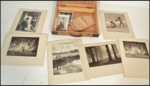 ARTHUR G. DELL Monochrome photograph of two young girls titled ' Confidences ', signed in pencil