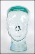 A vintage retro 20th century shop display / millinery mannequin head of pressed glass construction