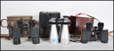 A group of three vintage binoculars to include a pair of Carl Zeiss Deltrintem 8 x 30 binoculars and