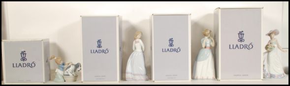 A collection of four Lladro ceramic figurines to include A Proper Pose 6124, Sweet and Shy 6754,