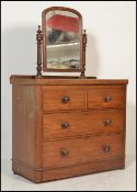 A Victorian mahogany dressing chest of drawers being raised on a plinth base with short and deep