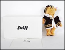 A boxed Steiff teddy bear titled 'Henry VIII' limited production No. 290, having relevant labels and