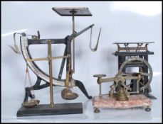 A collection of four sets of scales dating from the 19th Century to include a set of