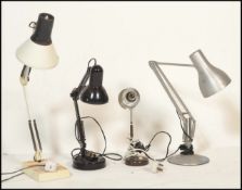 A group of three retro 20th century anglepoise desk lamps of different styles to include one in a
