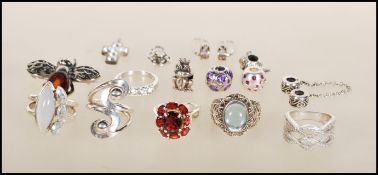 A collection of silver jewellery to include six silver rings including a fine stone CZ ring, a dress