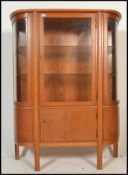 A vintage  early 20th century French Art Deco style bow fronted glazed vitrine display cabinet /