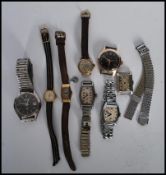 A collection of eight mens wrist watches together with a selection of ladies cocktail watches to