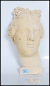 A contemporary 20th Century head wall hanging sculpture of Venus De Milo made from plaster. Measures
