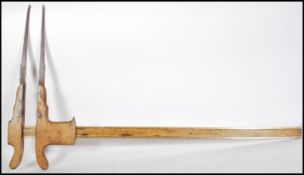 A set of 19th Century forestry calipers for measuring trees having a sliding guide constructed