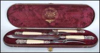 A Joseph Rodgers & Sons carving set having carved candy twist handles to include two carving