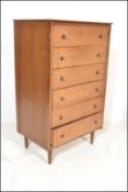 A mid century teak wood Danish influence pedestal chest of drawers. Raised on angular legs, the