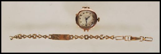 A 9ct gold London hallmarked ladies dress watch. Inset 15 Jewel movement being Swiss made.