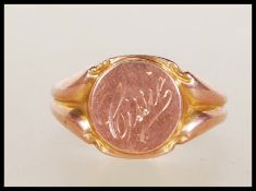 A hallmarked 9ct gold signet ring having a central round panel engraved ' Cissie '. Hallmarked