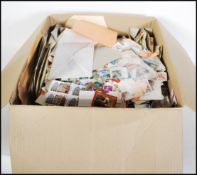 A box of loose stamps dating from the 19th Century to include British examples, Ceskoslovenska,