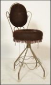 A retro vintage 20th century bedroom boudoir wire work dressing table chair having a scroll work