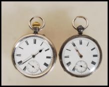 Two silver hallmarked open face pocket watches, both having white enamel face with Roman numeral