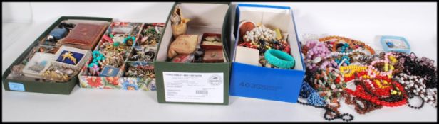 A large good collection of mid 20th century costume to include necklaces, bangles, breacles,