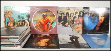 A collection of long play LP vinyl records from various artists to include Slade, Wreckless Eric,