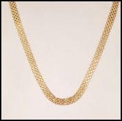 A hallmarked 9ct gold mesh chain necklace having a lobster clasp. Bearing import marks for 1986.