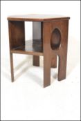 A early 20th Century Arts & Crafts oak hexagonal side table. Raised on arched supports with