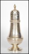 A 20th Century silver hallmarked sugar shaker sifter, with pierced domed top, baluster shaped body