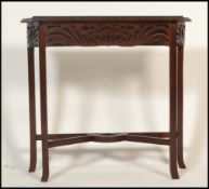 An early 20th Century 1910 Art Nouveau mahogany hall / console table having a pierced fretwork