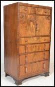 A early 20th Century Art Deco walnut veneered tall