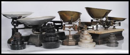 A collection of four 19th Century balance scales, and weights, three of the scales of cast metal