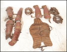 A selection of mid 20th Century 1950's baseball equipment to include three metal and leather