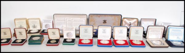 A collection of cased silver proof coins, in capsules and cases most with certificates together with