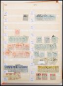 A stamp album containing stamps dating from the 19th Century, all British strarting with Queen
