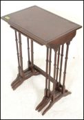 A late 19th Century Victorian mahogany nest of three tables having boxwood inlay decoration with