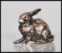 A 20th Century silver hallmarked figure in the form of a rabbit. Hallmarkes to base for London