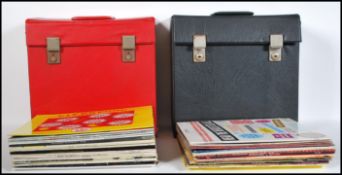 A collection of long play LP vinyl album records contained within two record cases featuring several