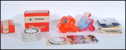 A group of vintage and retro View master slide viewers and slides to include boxed bakelite 3-