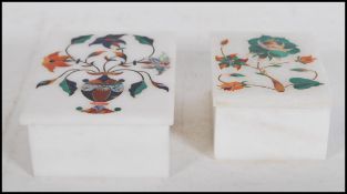 Two white marble boxes having semi precious stones inset into the lids creating floral decoration,